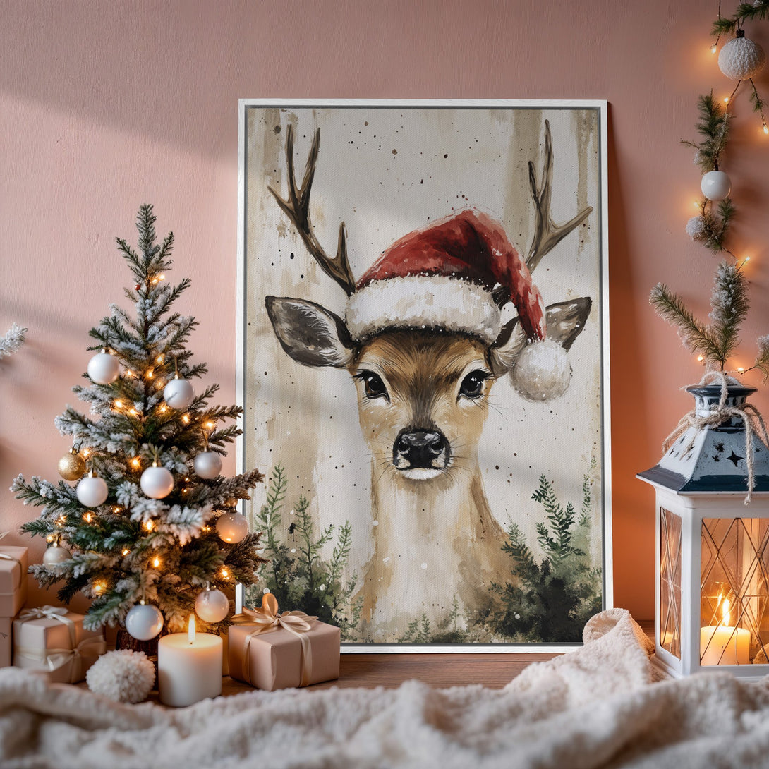Framed Wall Art: Watercolor deer in Santa hat. Warm, neutral tones with pops of red. Perfect Christmas decor for a cozy, festive home.