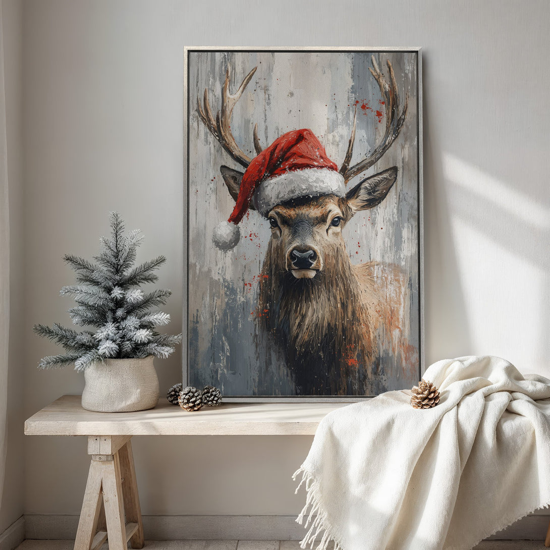 Framed Wall Art: Festive deer in Santa hat. Abstract style, neutral & red color palette. Perfect Christmas decor for a cozy, modern interior.