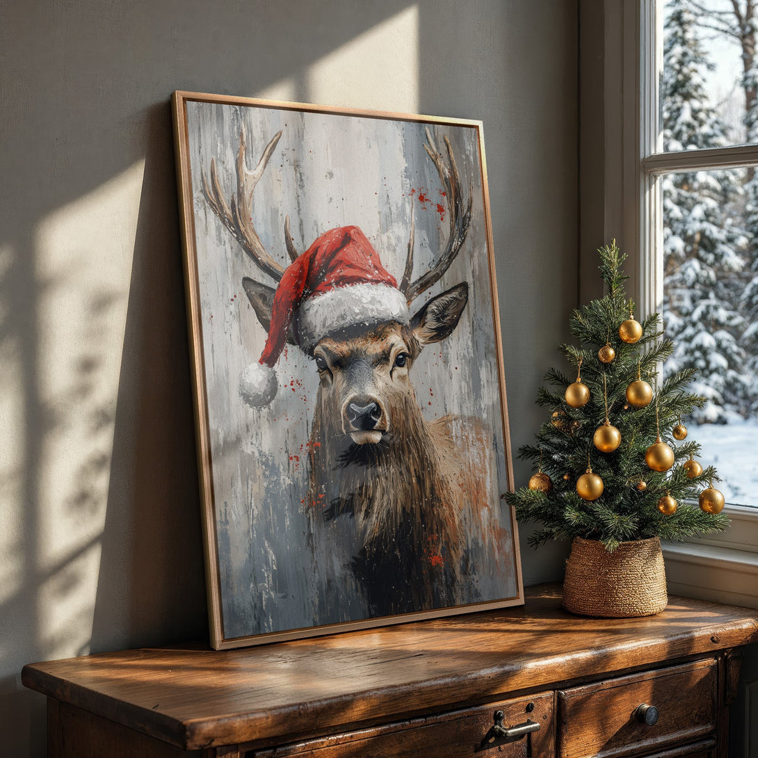 Framed Wall Art: Festive deer in Santa hat, abstract style, neutral & red palette. Perfect Christmas decor for a cozy, winter-themed home.