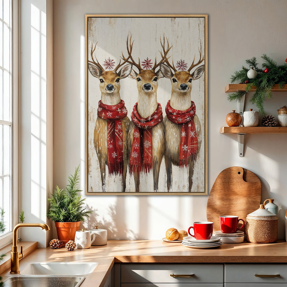 Framed Wall Art featuring three deer with red scarves, painted in a rustic style. Warm color palette with browns, reds, and whites. Perfect for holiday decor.