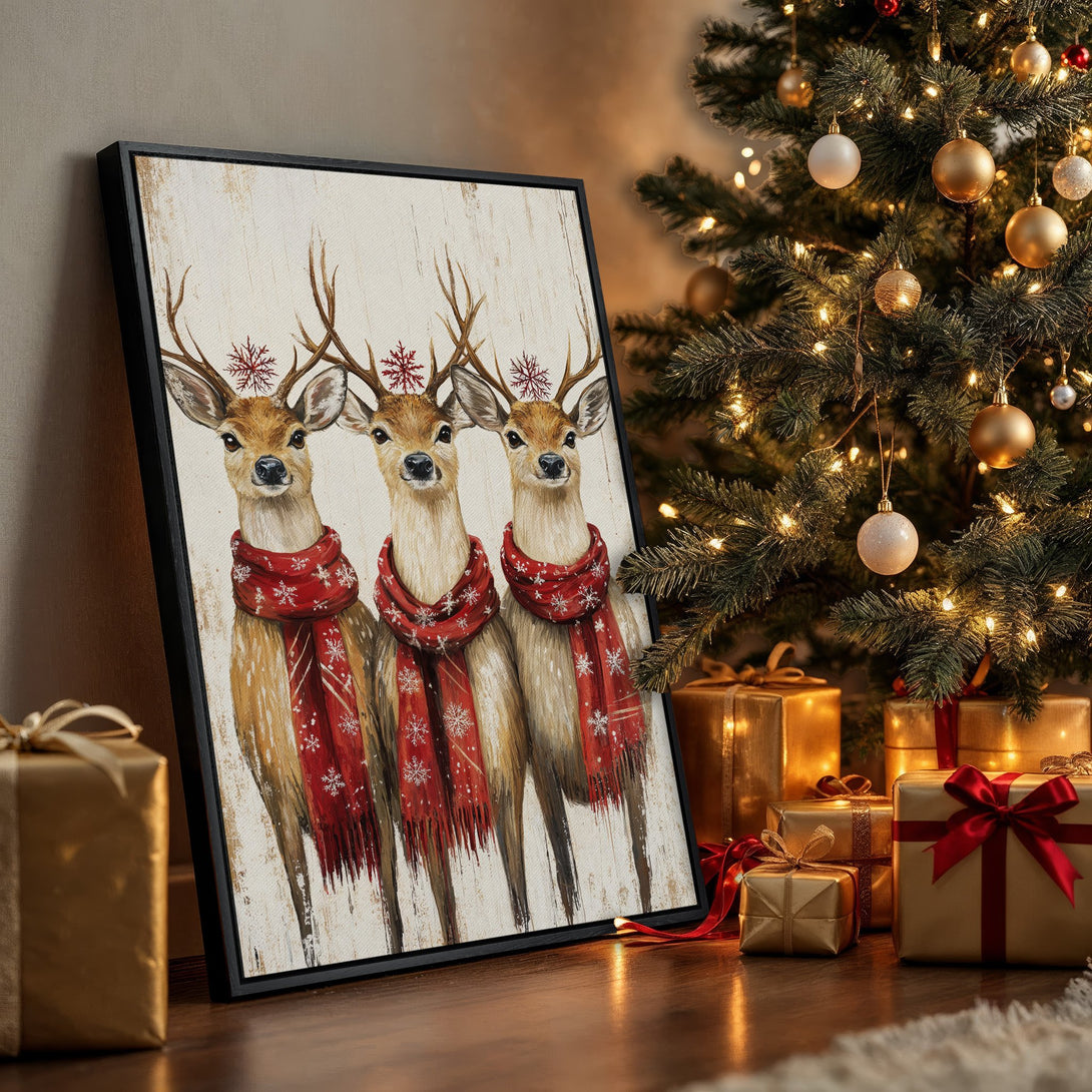 Framed Wall Art: Festive canvas print of three deer in red scarves, warm color palette. Perfect Christmas decor!