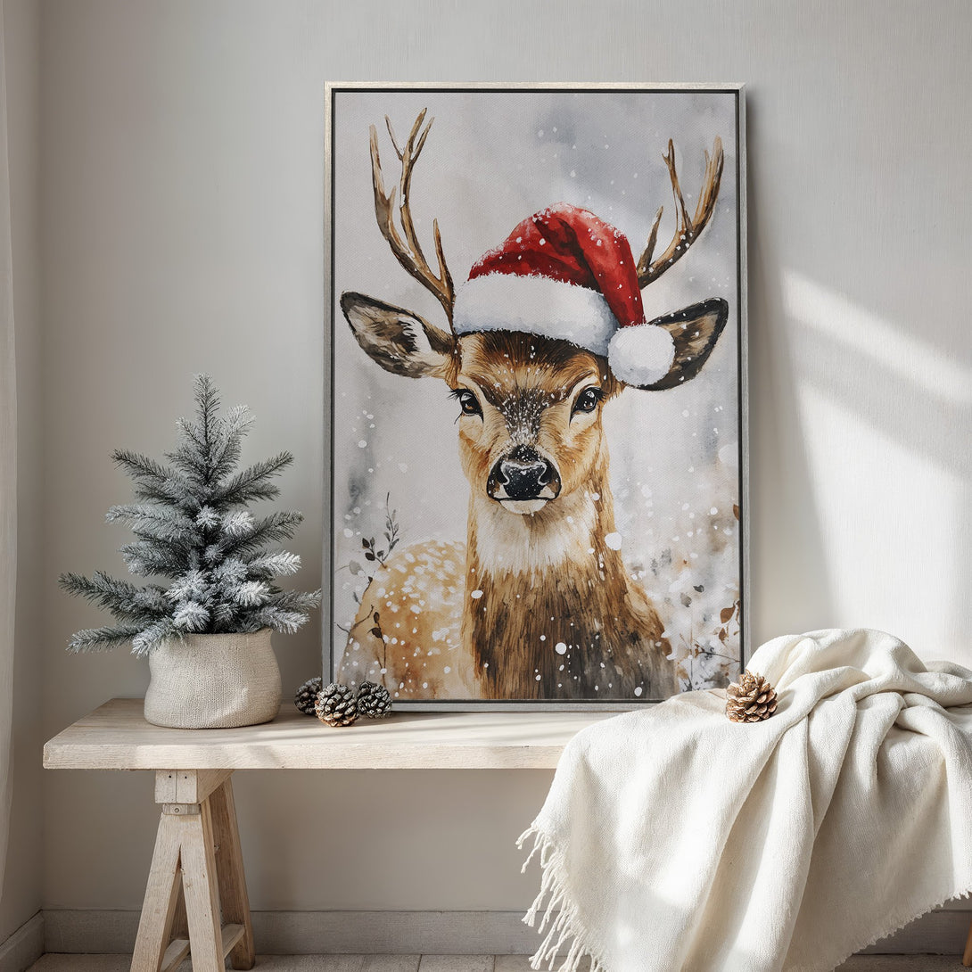 Framed Wall Art: Watercolor deer in Santa hat, neutral palette. Perfect Christmas decor for a cozy, festive home. Shop now!