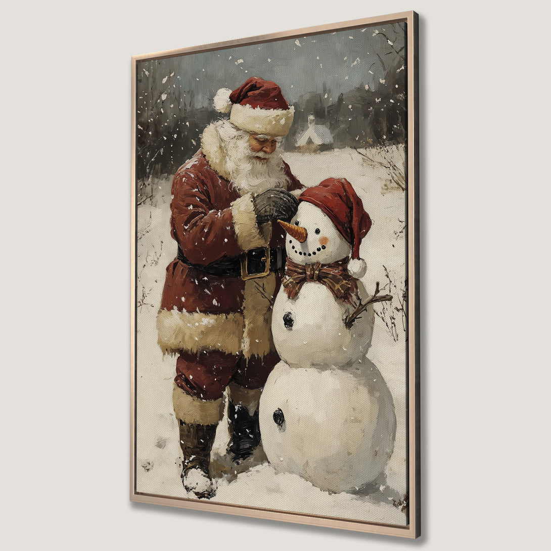 Framed Wall Art featuring Santa Claus building a snowman in a snowy landscape. Warm red and neutral tones create a cozy, vintage-style Christmas scene.