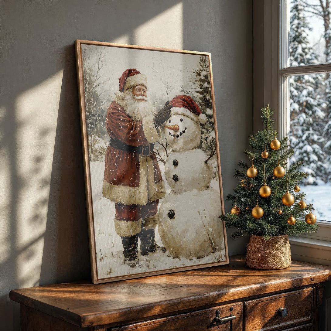 Framed Wall Art featuring Santa Claus and a snowman in a vintage style. Warm red and neutral tones create a cozy Christmas vibe for your home decor.