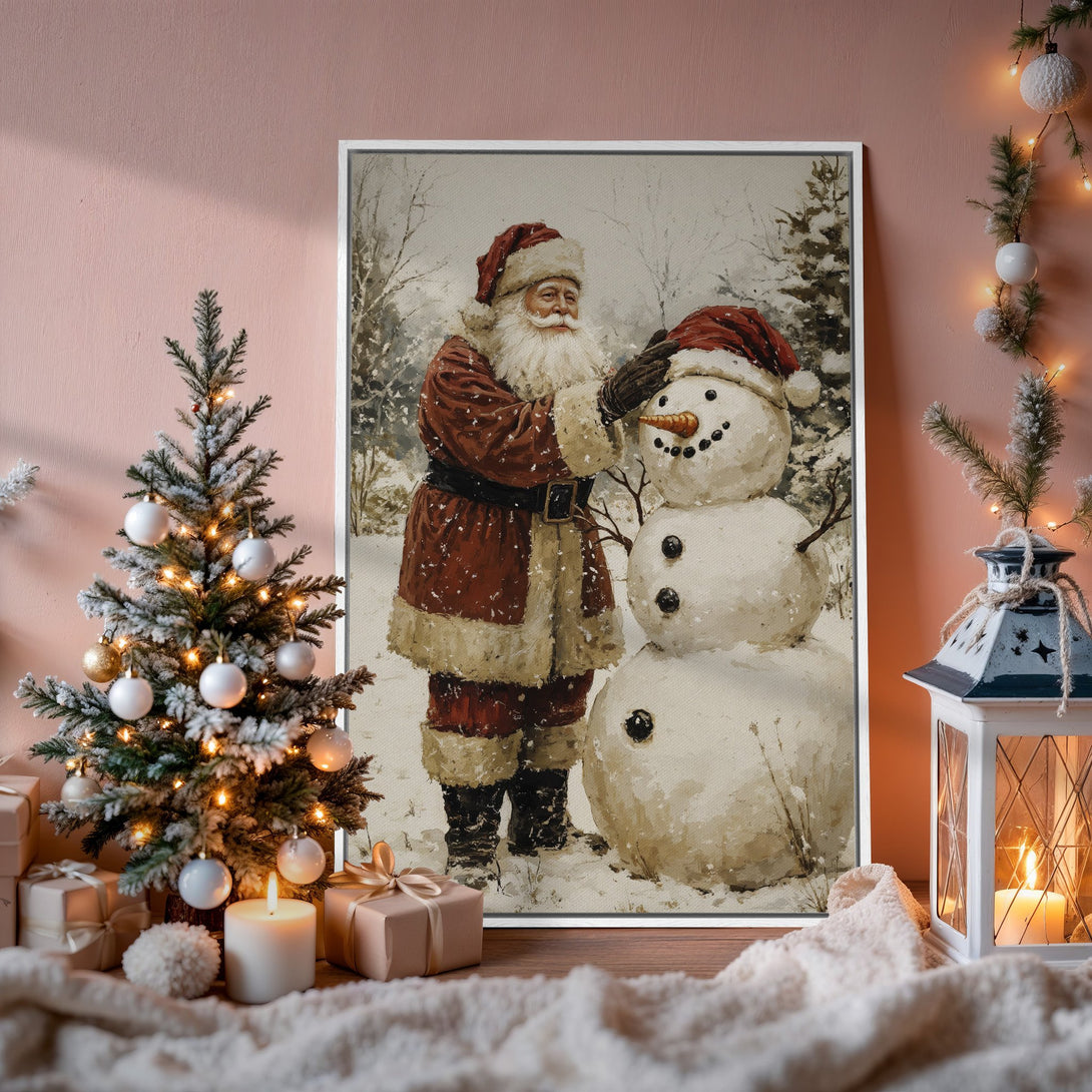 Framed Wall Art: Santa Claus building a snowman in a winter scene. Warm, neutral color palette with red accents. Perfect Christmas decor.