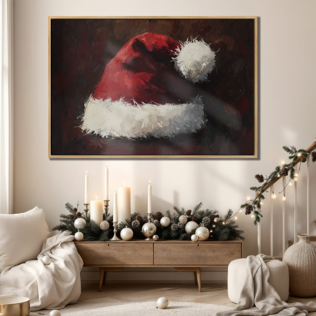 Framed Wall Art of a Santa hat in a warm, inviting interior. Rich red and white brushstrokes on a dark background. Perfect Christmas decor.