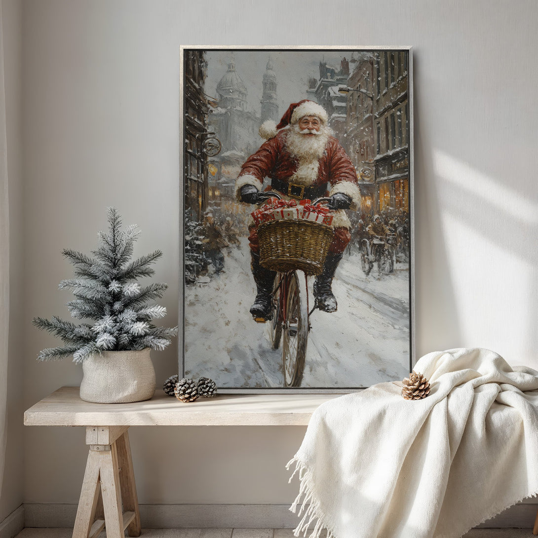 Framed Wall Art: Santa Claus riding a bicycle through a snowy street. Impressionistic style, warm red and cool gray tones. Perfect Christmas decor!