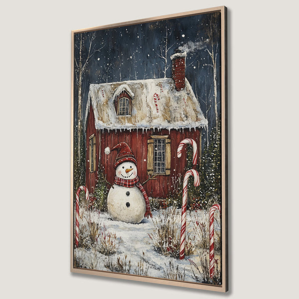 Framed Wall Art: Cozy winter scene with snowman & red cabin. Charming holiday decor in a rustic style with a blue, red, and white color palette. Perfect for Christmas!