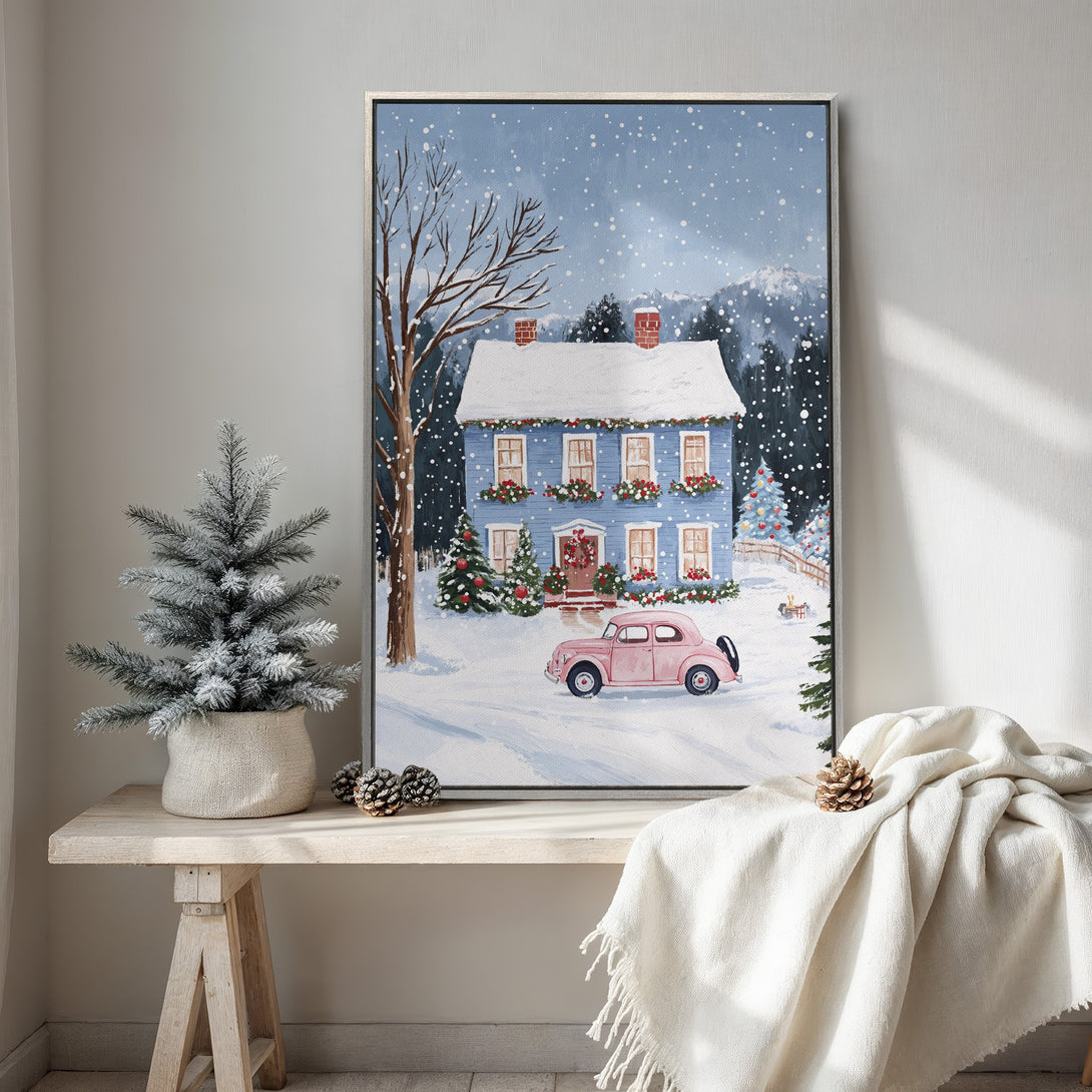 Framed Wall Art: Winter scene canvas print with a blue house, pink car, and snowy landscape. Cozy, whimsical style in blue, white, and pink tones. Perfect holiday decor!