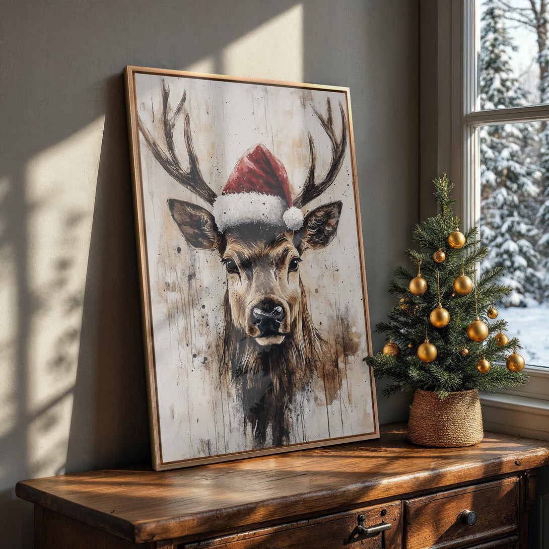 Framed Wall Art: Watercolor deer in Santa hat, neutral palette. Rustic holiday decor for cozy living spaces. Shop festive art prints now!