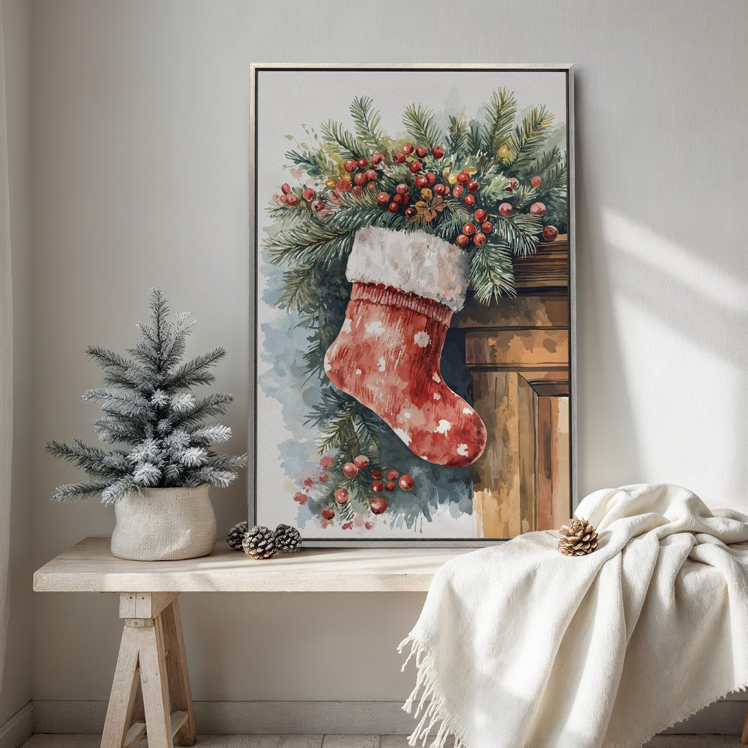 Framed Wall Art featuring a watercolor Christmas stocking and greenery. Warm, inviting color palette with red, green, and cream tones. Perfect holiday decor!