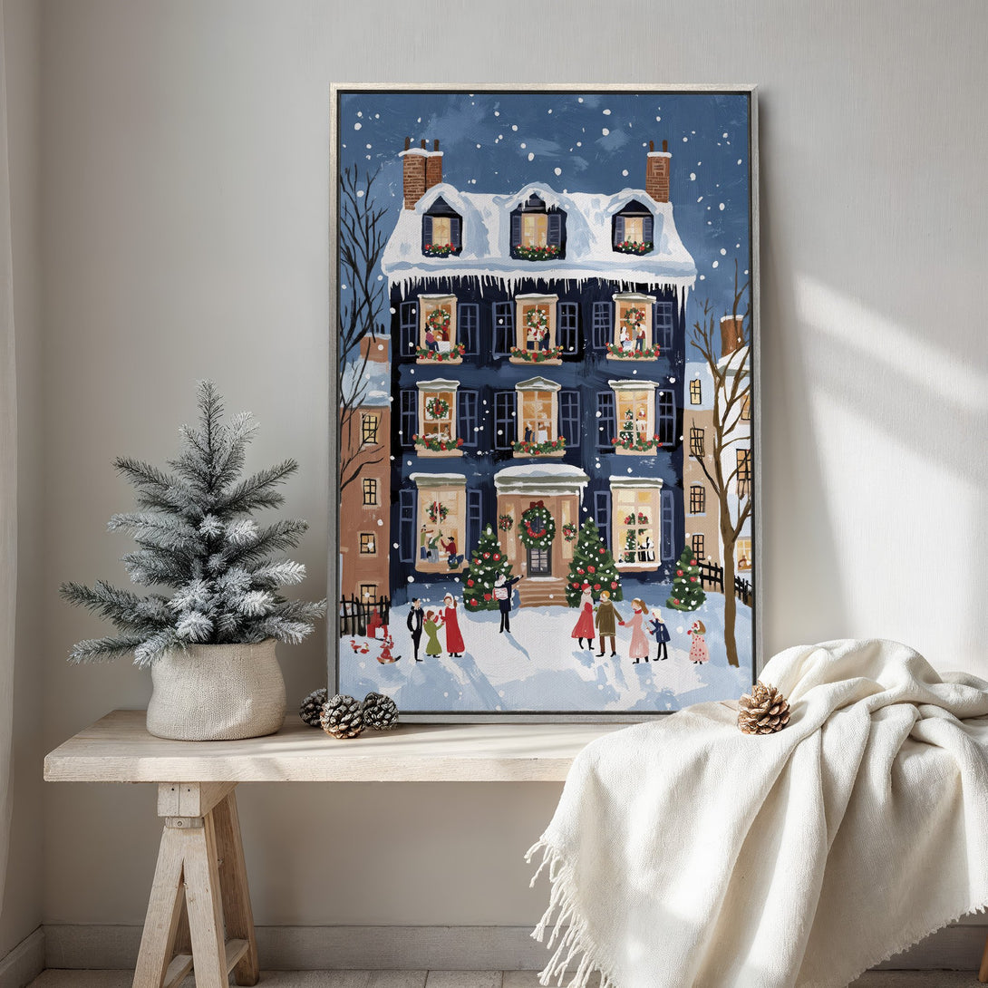Framed Wall Art: Winter scene Canvas Print with a blue and white color palette. Festive illustration of a snowy house with people celebrating Christmas.