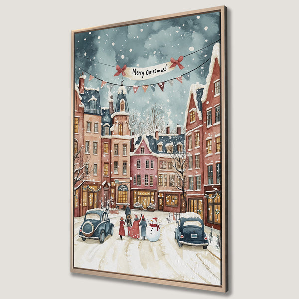 Framed Wall Art: Watercolor Christmas scene of snowy European village. Warm red and pink buildings, blue cars, and festive banner. Perfect holiday decor!