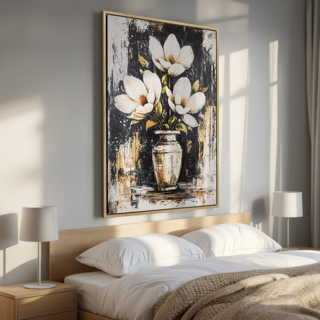 Framed Wall Art: Abstract floral canvas print in a bedroom. Features white magnolias on a black & gold background. Perfect for modern home decor.