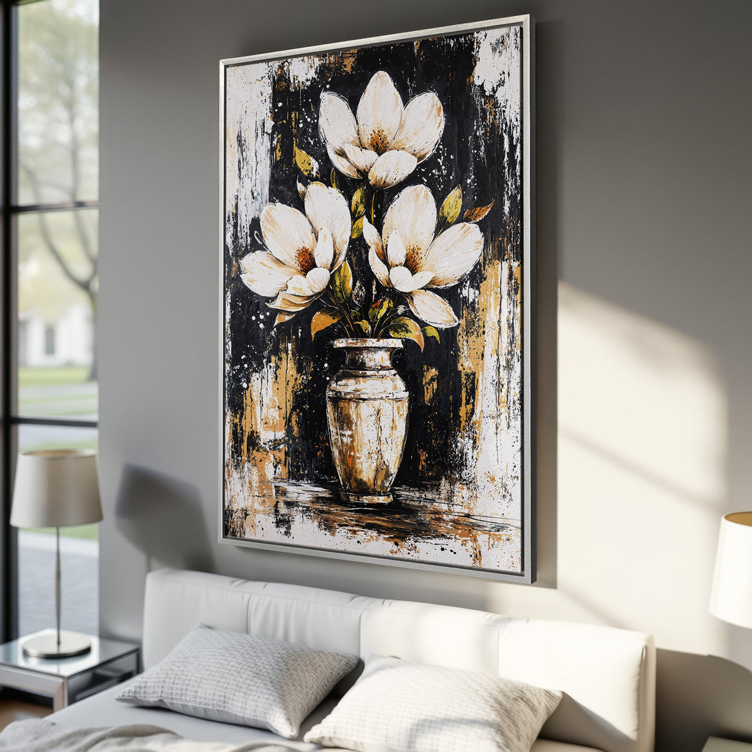 Framed Wall Art: Abstract floral canvas print in a bedroom. Features white magnolia flowers on a black & gold textured background. Modern home decor.