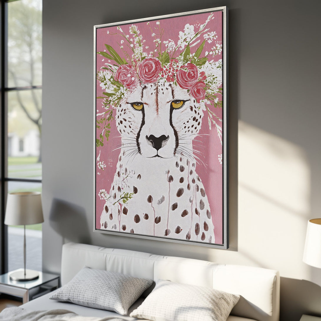 Framed Wall Art featuring a cheetah with a floral crown, painted in a whimsical style with a pink and white color palette. Perfect for adding a touch of nature to your decor.
