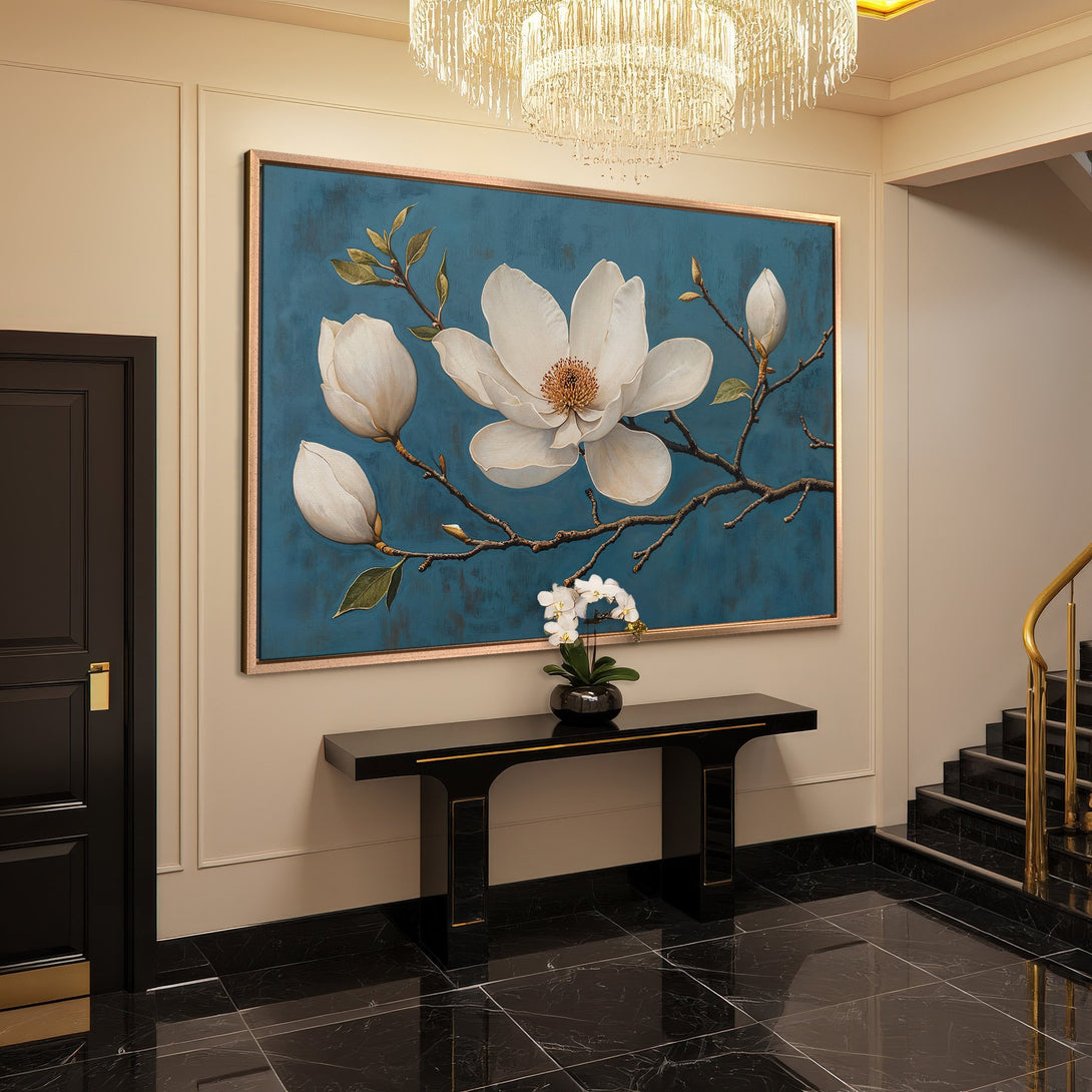 Framed Wall Art featuring a floral magnolia painting in a teal and white color palette, perfect for adding elegance to any interior.