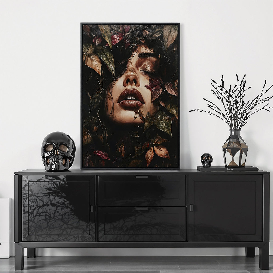 Framed Wall Art featuring a woman's face surrounded by leaves. Dark, moody artwork with a rich, earthy color palette. Perfect for adding a touch of elegance to your space.