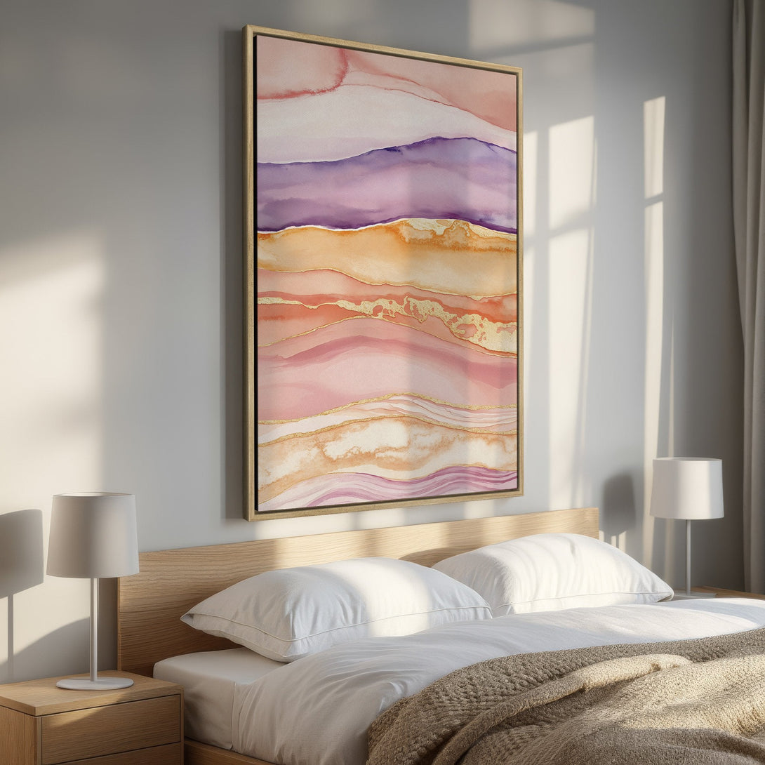 Framed Wall Art: Abstract watercolor print in a bedroom. Featuring a warm, earthy color palette with pink, purple, and gold accents. Perfect for modern home decor.