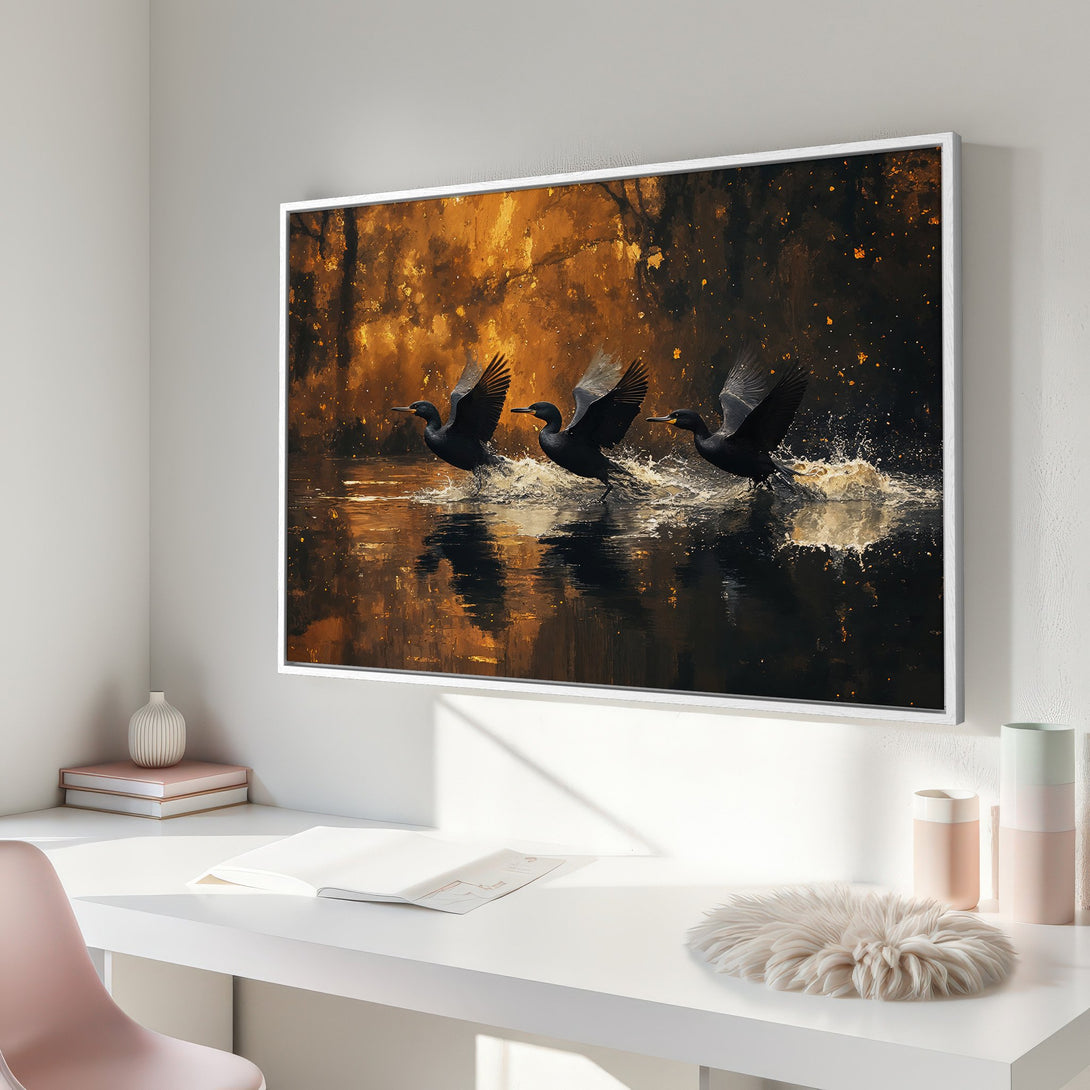 Framed Wall Art: Dramatic painting of black birds taking flight over water, warm gold and dark tones. Perfect for modern decor.