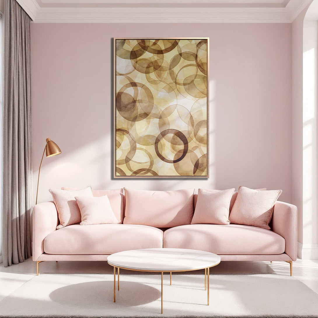 Framed Wall Art: Abstract circle design in warm brown tones. Modern art piece in a stylish living room with a blush pink color palette.