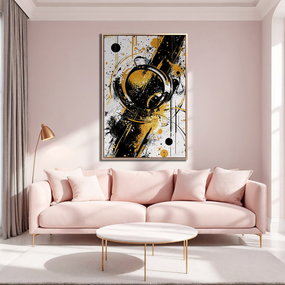 Framed Wall Art featuring abstract black, gold, and white artwork. Modern canvas print adds a stylish touch to a pink living room.