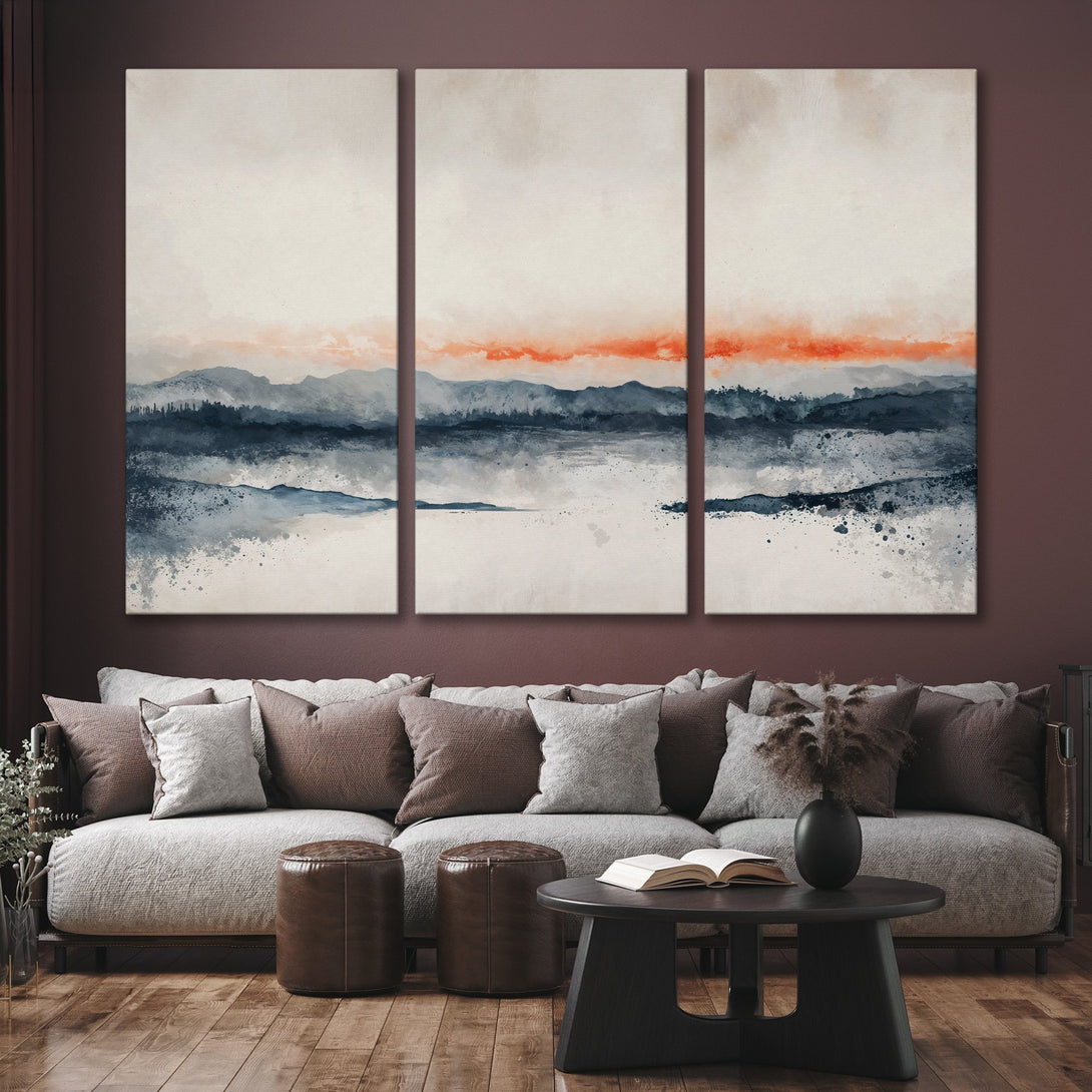 Abstract landscape Canvas Print in watercolor style. Features mountains, a warm orange sky, and a cool blue and gray palette. Perfect for modern decor.