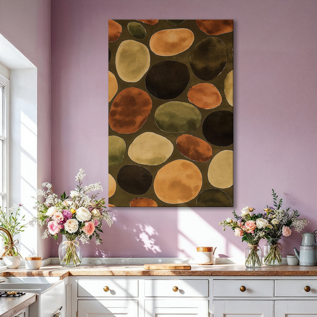 Framed Wall Art featuring abstract watercolor pebble design in warm earth tones. Perfect for adding a touch of modern art to your living room.