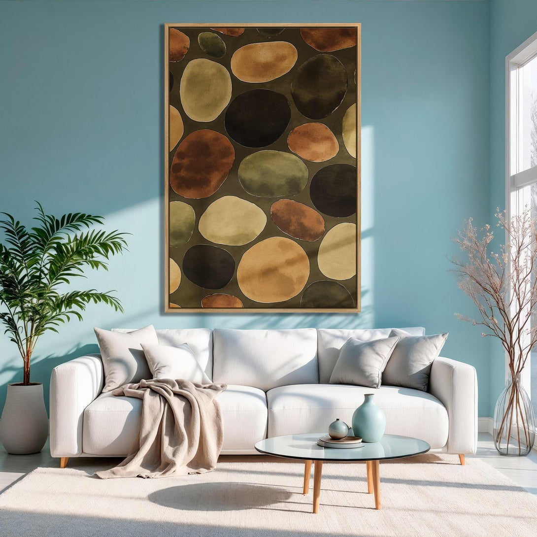 Framed Wall Art featuring abstract pebble design in earthy tones. Modern living room decor with a calming color palette. Perfect for adding art to your space.