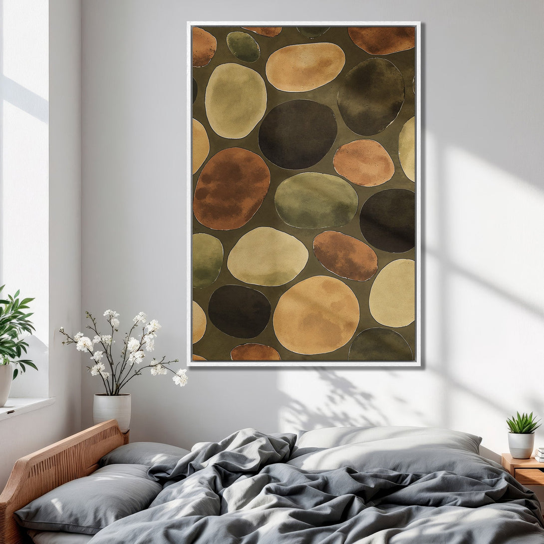 Framed Wall Art featuring an abstract pebble design in earthy tones. Perfect for adding a touch of nature-inspired art to your bedroom decor.