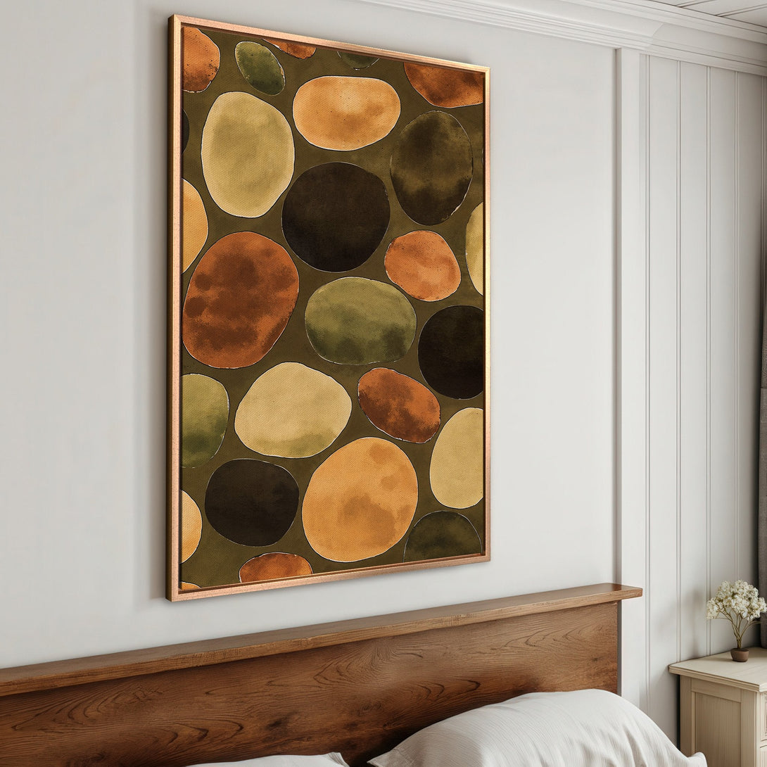 Framed Wall Art featuring an abstract pebble design in warm earth tones. Perfect for adding a touch of modern art to your bedroom decor.