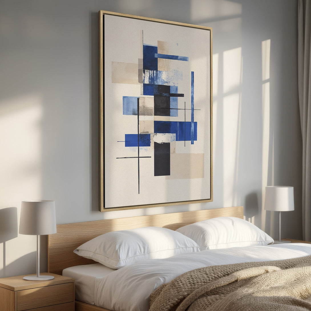 Framed Wall Art featuring an abstract geometric design in blue, beige, and black. Modern art canvas print adds a stylish touch to any bedroom.