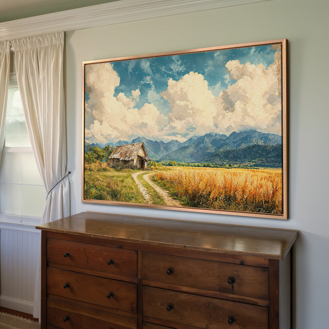 Framed Wall Art: Rustic landscape Canvas Print with warm tones. Featuring a farmhouse, mountains, and wheat field. Perfect for adding a cozy touch to your space.