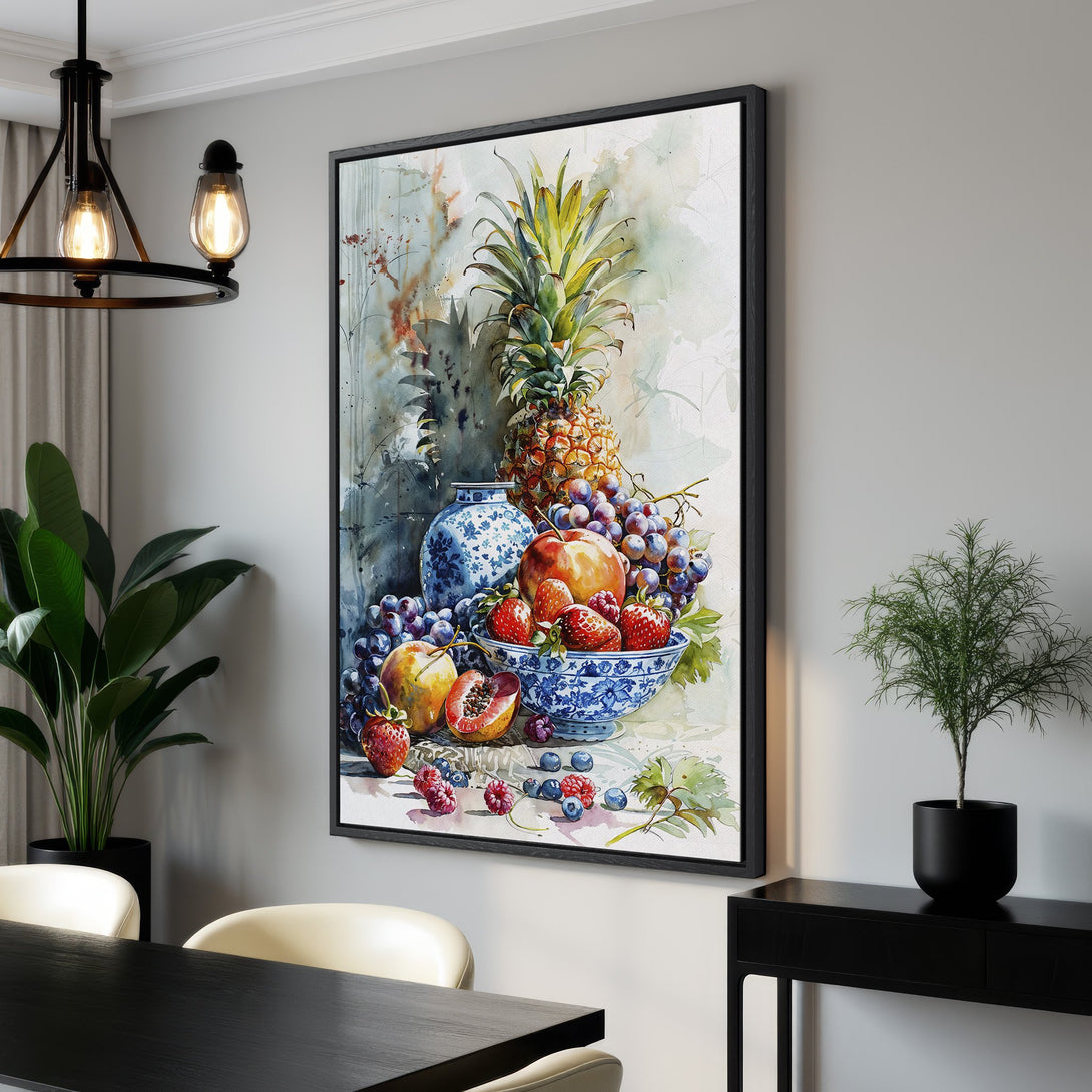 Framed Wall Art of a watercolor fruit still life in a dining room. Features pineapple, grapes, and peaches in a blue and green color palette.