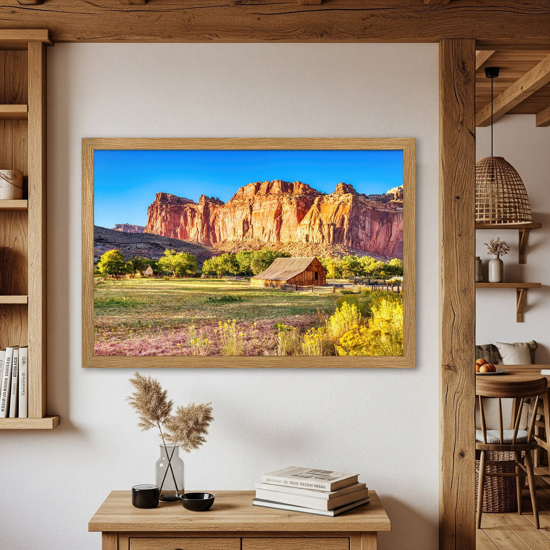 Framed Poster of a scenic landscape with a barn, featuring warm tones and a rustic style. Perfect wall art for your home!