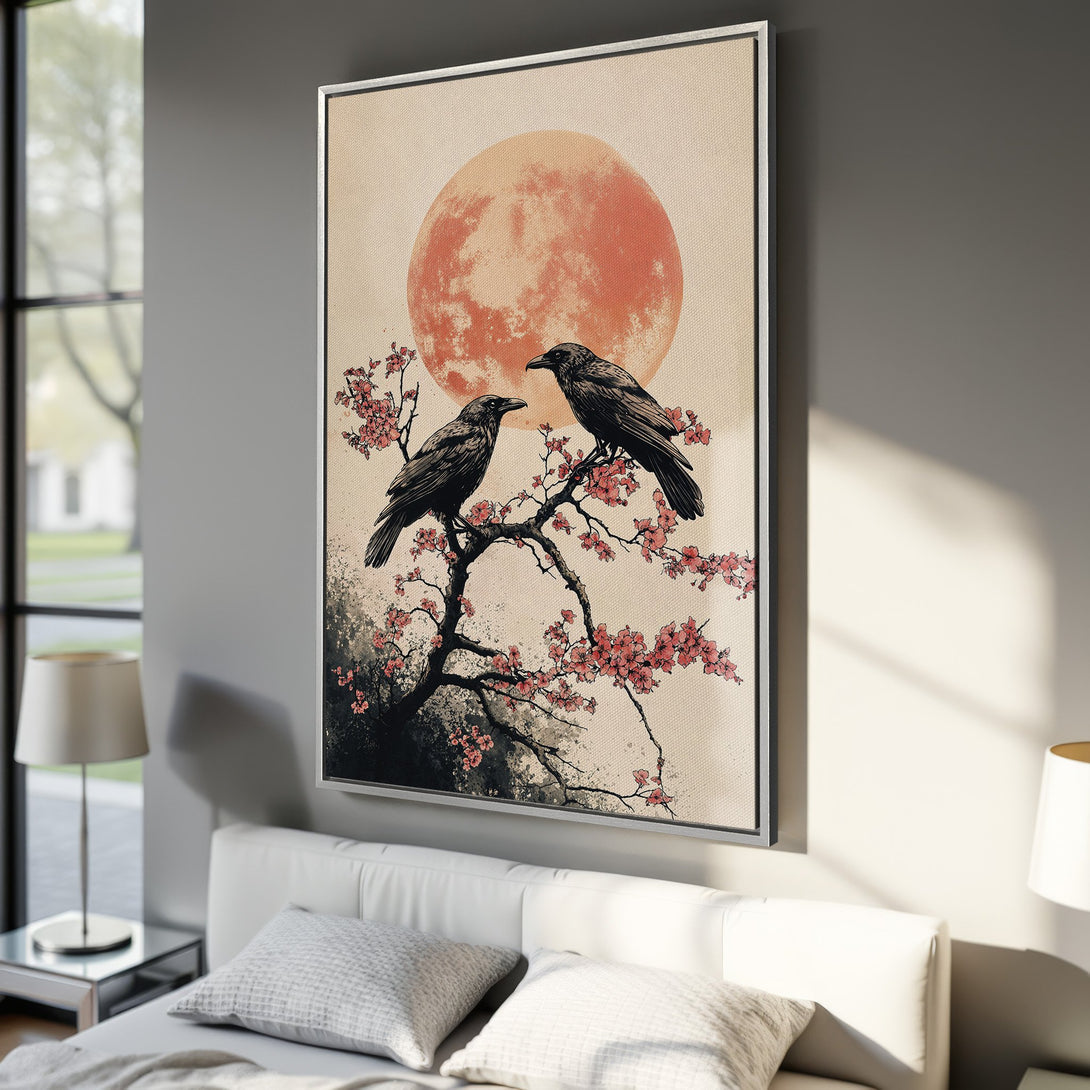 Framed Wall Art: Japanese-inspired canvas print featuring crows on a cherry blossom branch against a peach moon. Perfect for adding zen to your space!