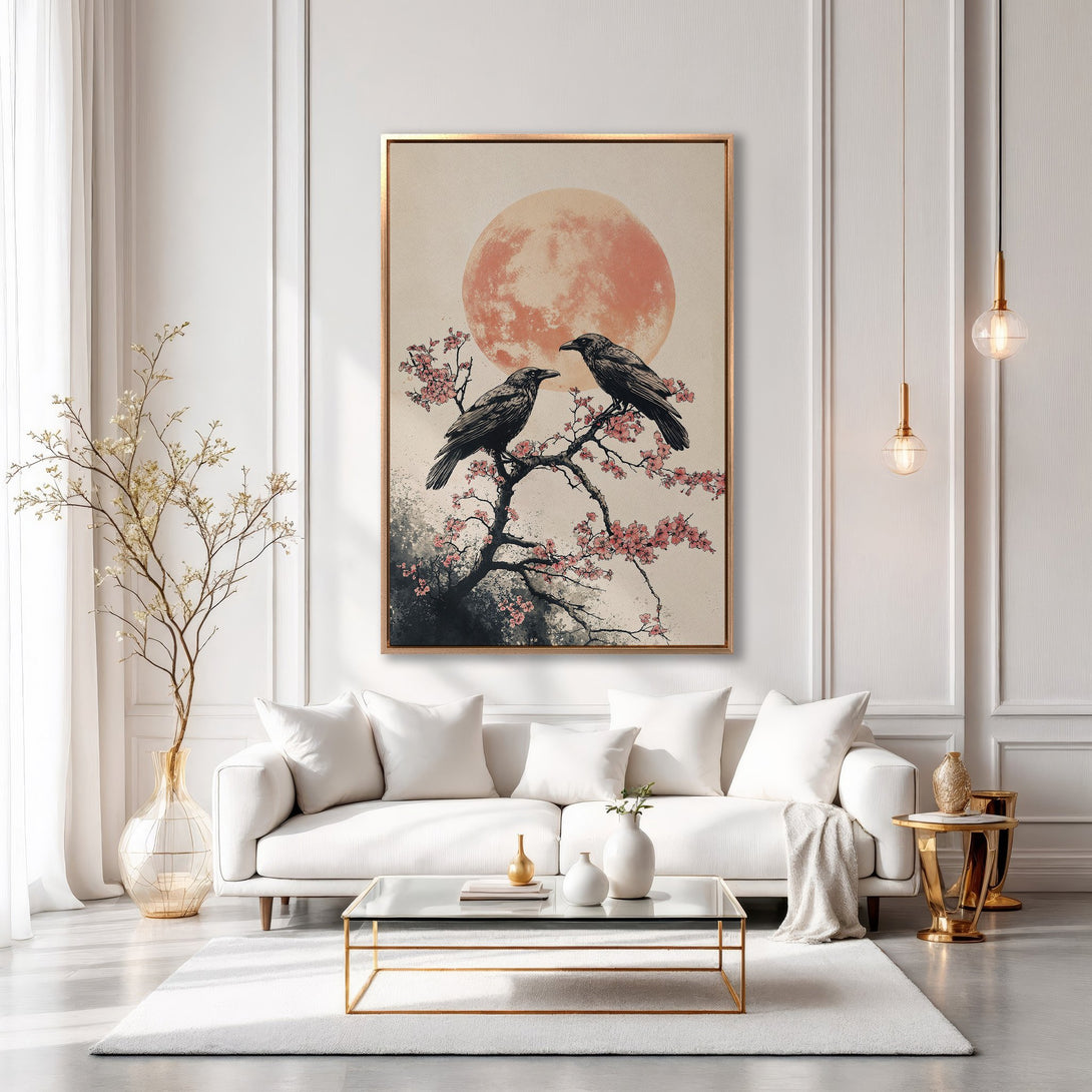 Framed Wall Art: Japanese-inspired canvas print featuring crows on a branch with a red sun. Neutral tones with pops of pink, perfect for modern decor.