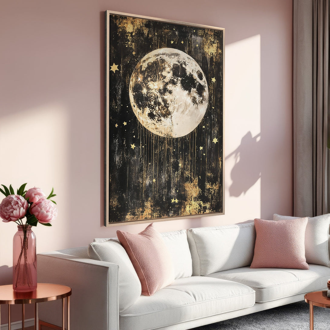 Framed Wall Art featuring a celestial moon and stars in a modern, abstract style. Black, gold, and blush color palette, perfect for adding a touch of elegance.