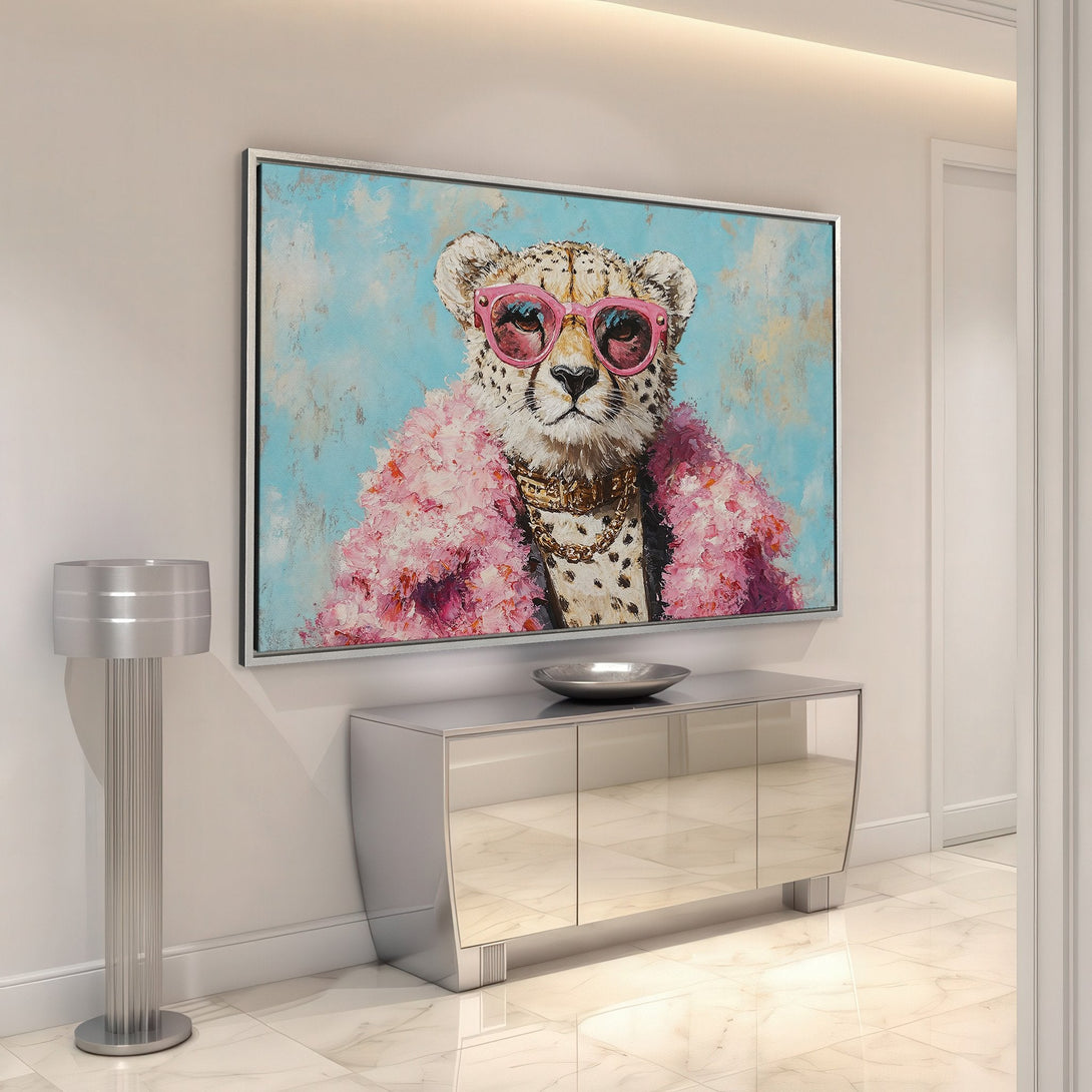 Framed Wall Art: Stylish cheetah portrait with pink accents. Modern canvas print in a chic interior, featuring a blue and pink color palette.