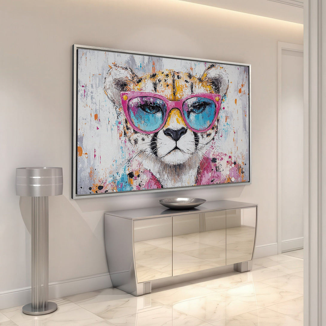 Framed Wall Art: Playful cheetah portrait in vibrant pink, blue, and orange abstract style. Modern art for a stylish interior.