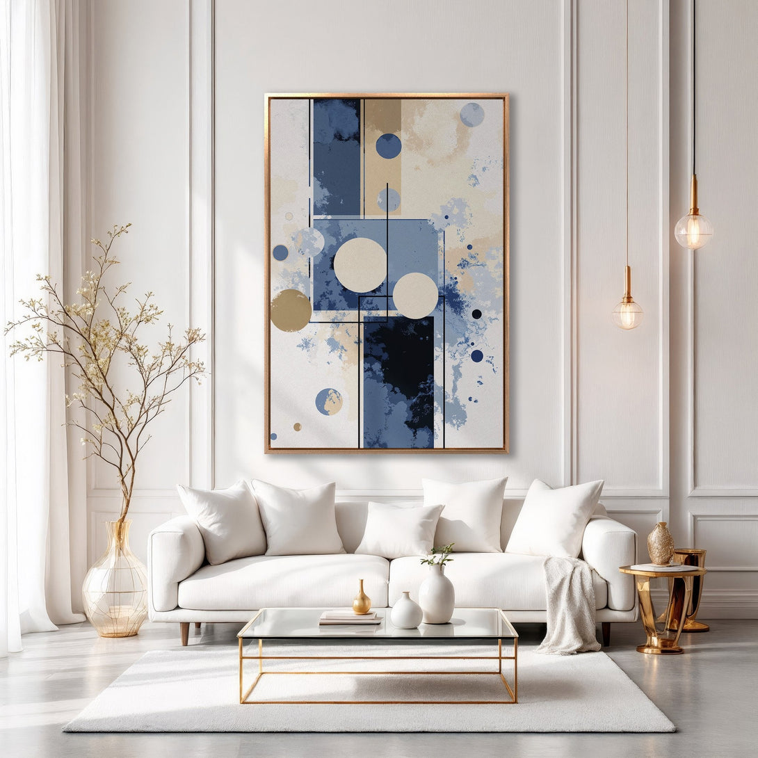 Framed Wall Art: Modern abstract art in blue, beige, and gold, adding a touch of elegance to a contemporary living room. Shop our Canvas Print collection today!