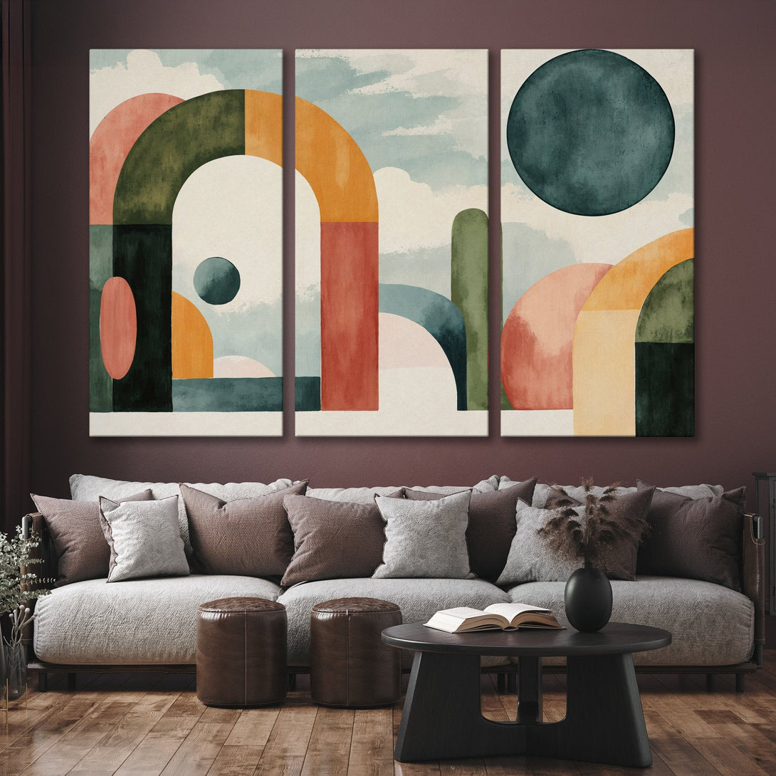 Abstract Canvas Print art in a modern interior. Features geometric shapes in earthy tones of green, orange, and pink. Perfect wall decor!