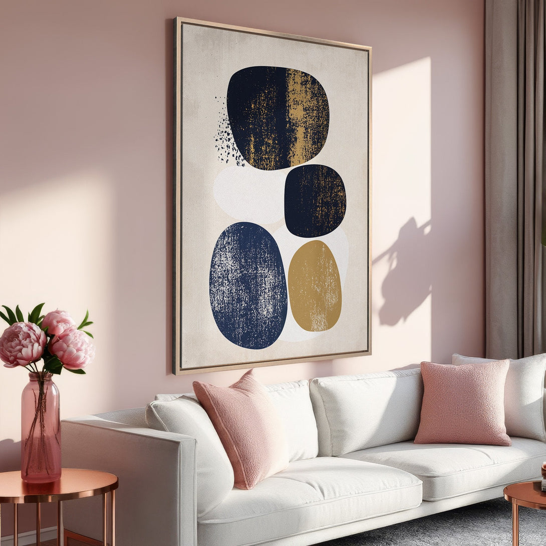 Framed Wall Art: Abstract art print with navy, gold, and white shapes. Modern art decor in a blush pink interior. Elevate your space with this stylish canvas.