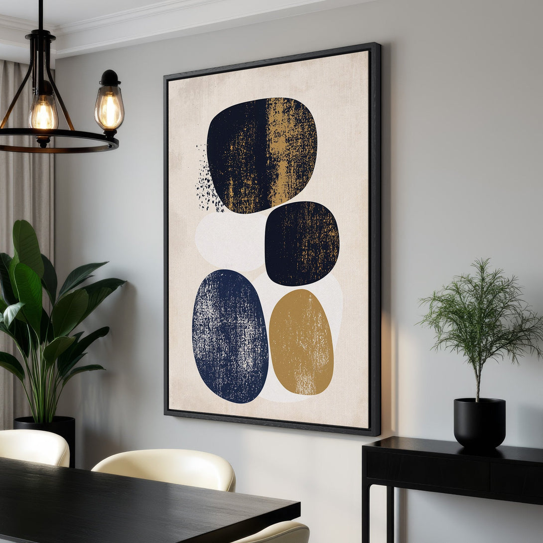 Framed Wall Art: Modern abstract art print featuring organic shapes in navy, gold, and white on a neutral background. Perfect for adding a touch of style to your home.