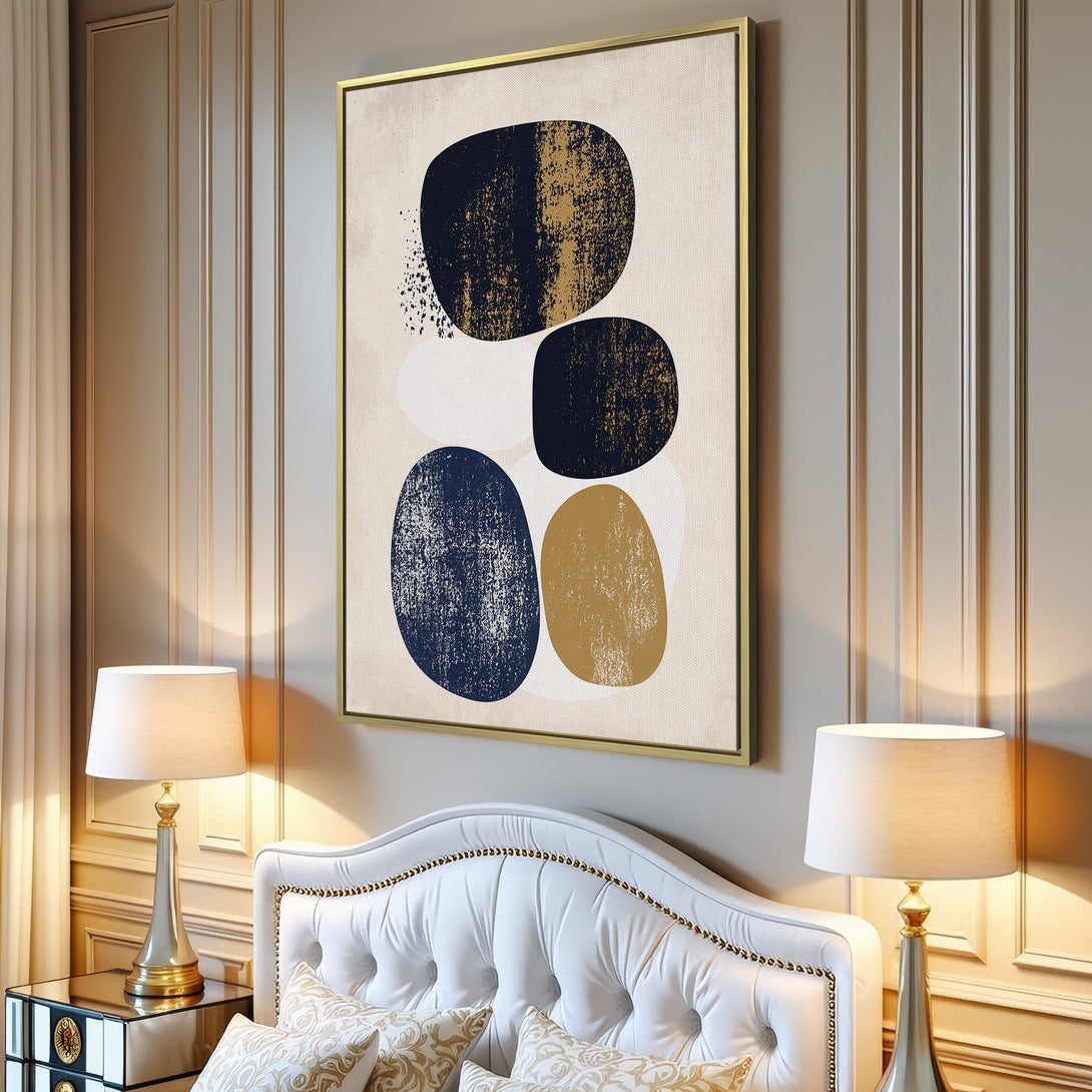 Abstract Canvas Print in a modern interior. Features navy, gold, and beige organic shapes. Perfect wall art for a minimalist living room.