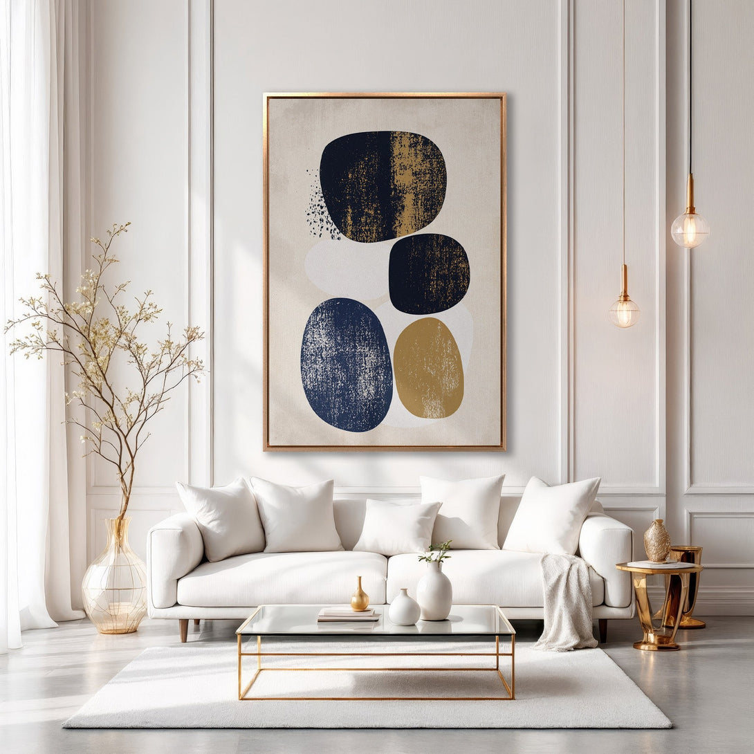 Framed Wall Art: Abstract art Canvas Print in a modern living room. Features navy, gold, and neutral tones. Elevate your space with this stylish artwork!