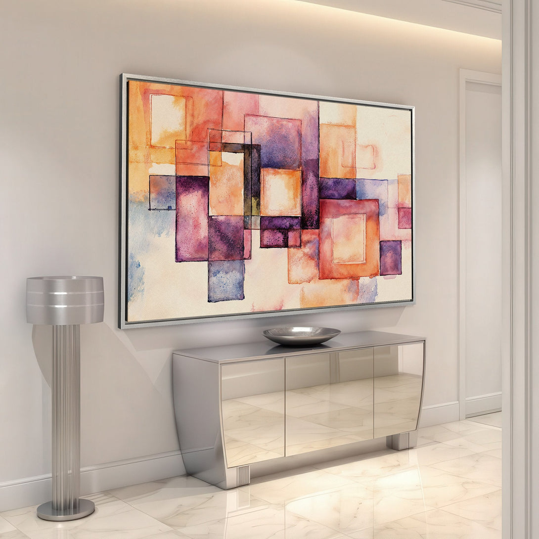 Framed Wall Art featuring an abstract watercolor design in warm orange, purple, and blue tones. Modern art for your home.