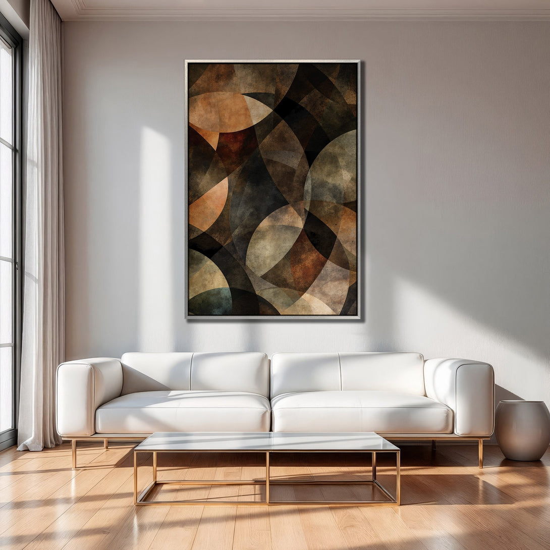 Framed Wall Art: Abstract geometric art in warm earth tones. Modern canvas print adds style to a living room with a white sofa and gold accents.