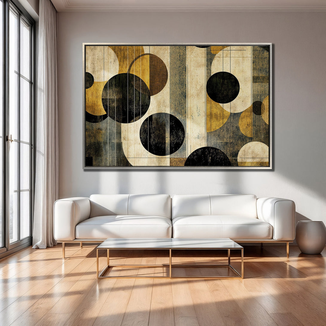Framed Wall Art featuring an abstract geometric design with circles and a neutral color palette of gold, black, and beige, perfect for modern interiors.
