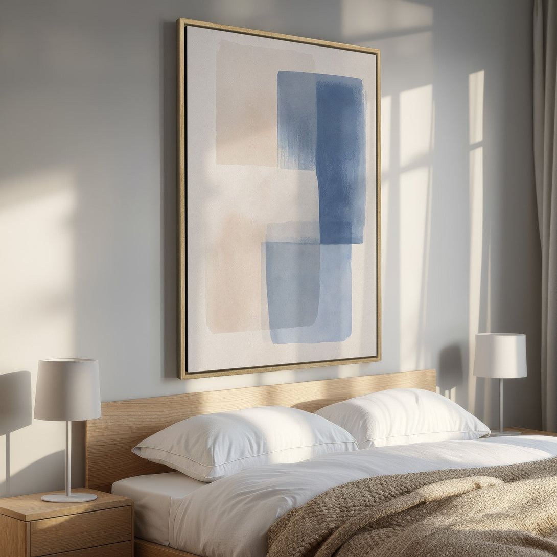 Framed Wall Art featuring abstract blue and beige brushstrokes. Modern art canvas print in a bedroom setting, perfect for minimalist decor.